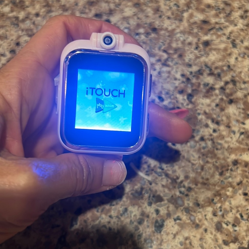 Itouch watch, camera, I think , game and photos has never been used. No box
